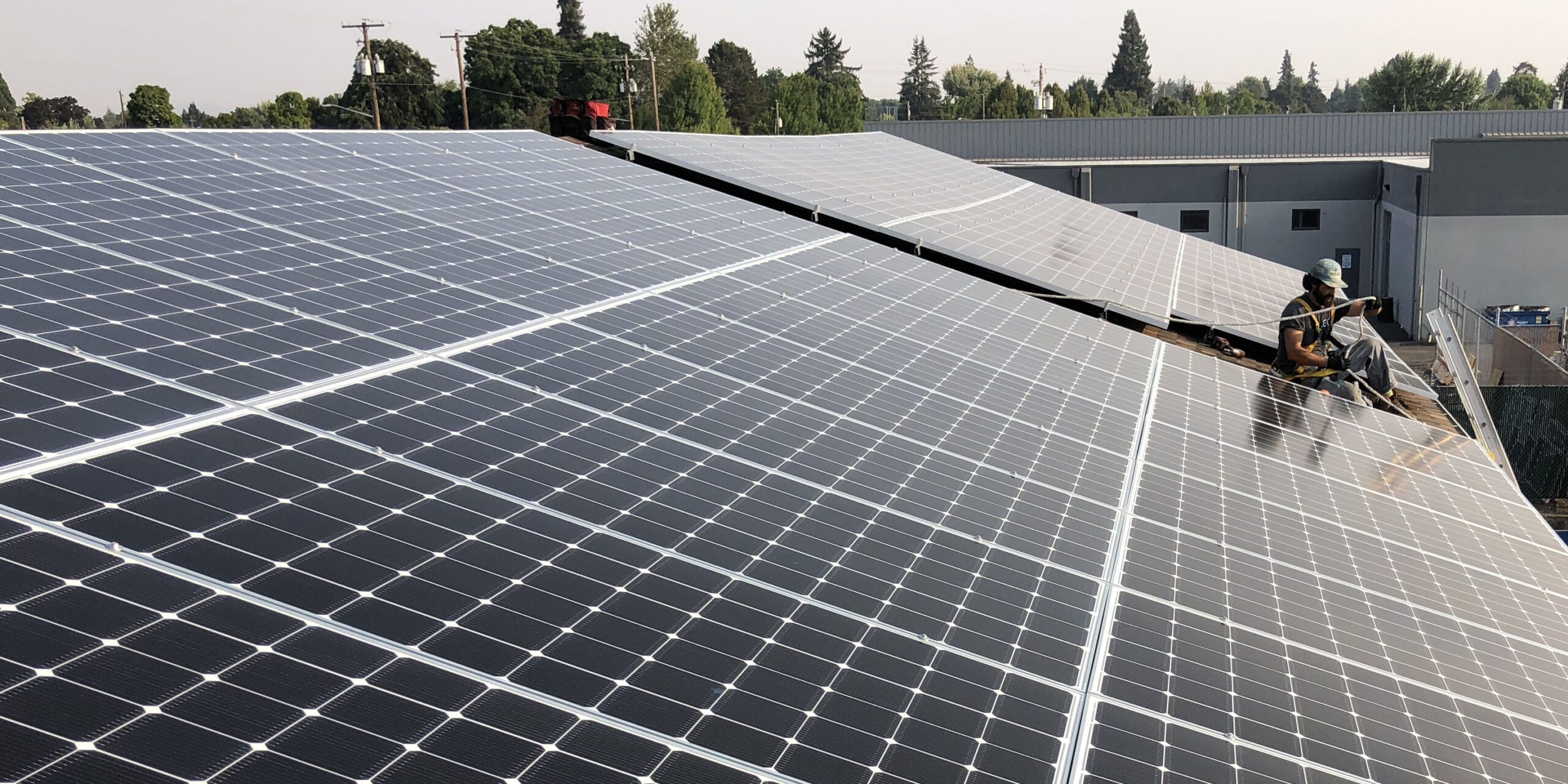 Energy Design Company crew installs solar panels on a nonprofit building in Oregon